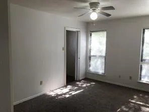 a view of an empty room with a window