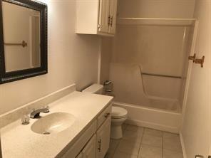 3104 Timber Ridge Grapevine, TX 76051 - Photo 8 of 12 a bathroom with a sink toilet and shower