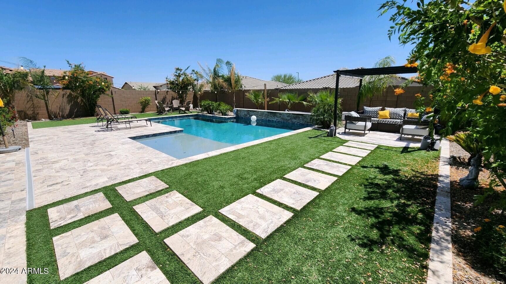 18261 West Tecoma Road Goodyear, AZ 85338 - Photo 40 of 47 Gorgeous travertine & synthetic grass