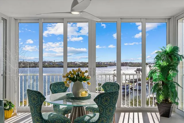 a view of a dining room with furniture window and outside view