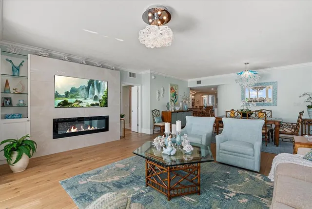 a view of a dining room with furniture wooden floor and a chandelier