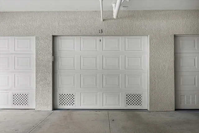 an aerial view of a house with a yard and potted plants