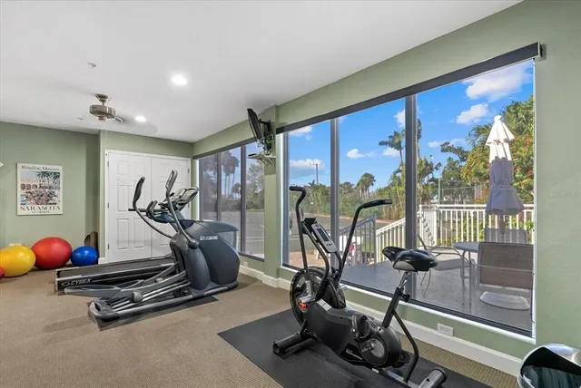 an aerial view of a house with outdoor space and sitting area