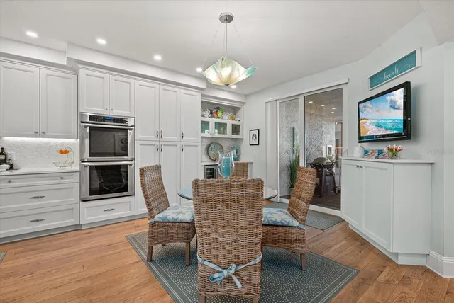 a kitchen with stainless steel appliances granite countertop a sink and cabinets