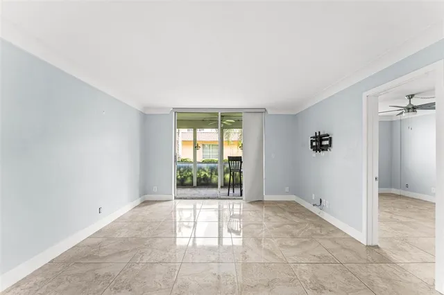 a view of room with walk in closet and entryway