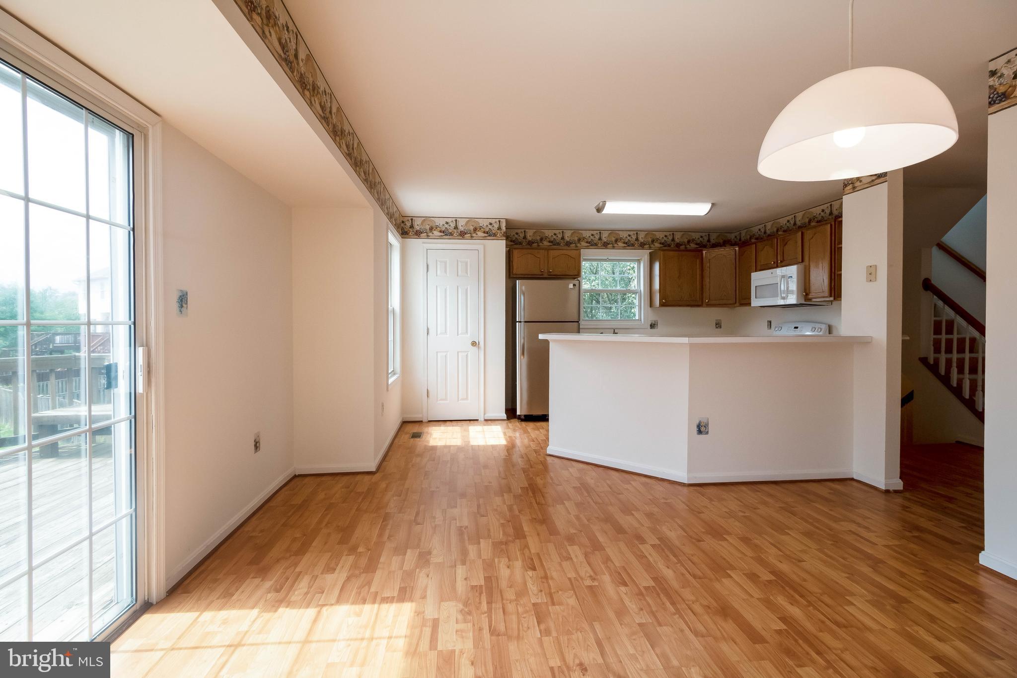 8441 Tackhouse Loop Gainesville, VA 20155 - Photo 13 of 47 Kitchen & Family Room