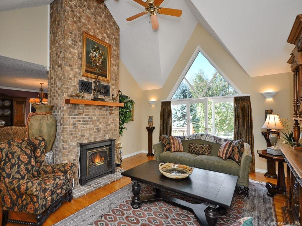 630 Parrish Farm Road Waynesville, NC 28786 - Photo 3 of 24 a living room with furniture and a fireplace