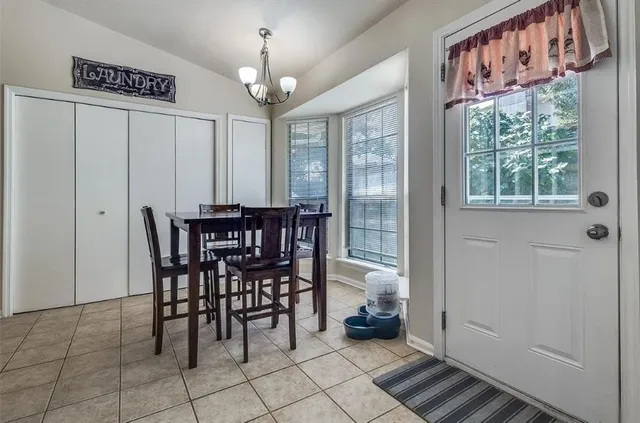 a view of a dining room with furniture window and outside view