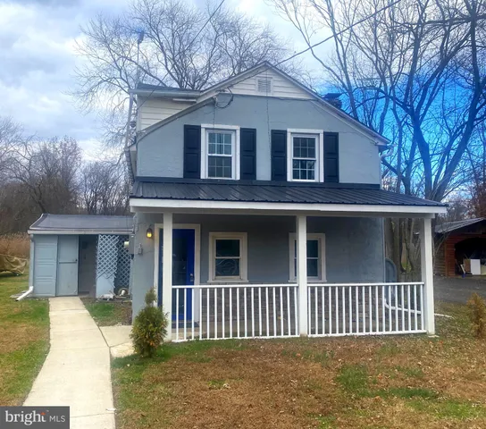 a front view of a house with a porch