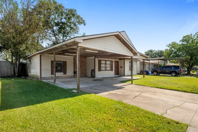 a front view of a house with a yard and porch