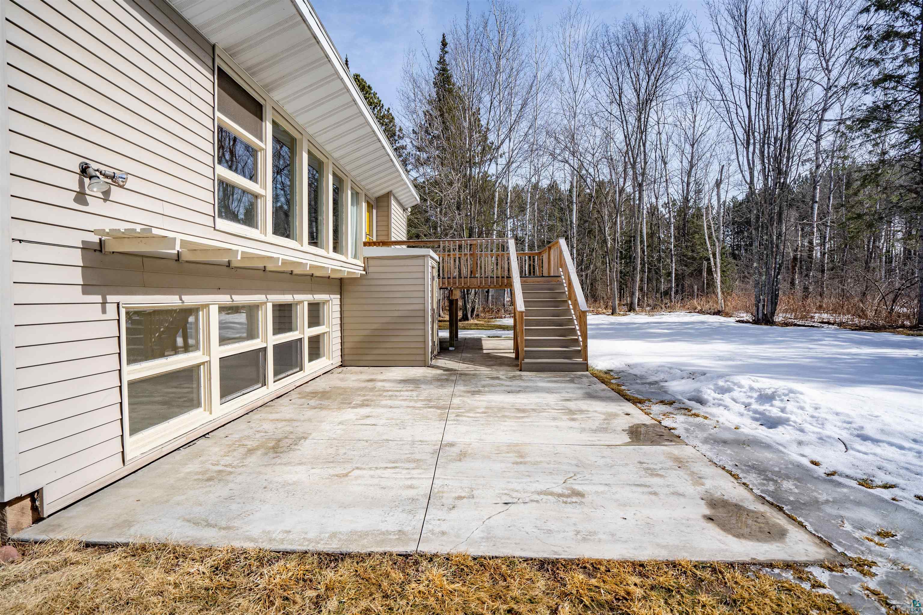 26 Riverside Road Esko, MN 55733 - Photo 23 of 34 View of patio / terrace with stairway and a wooden deck