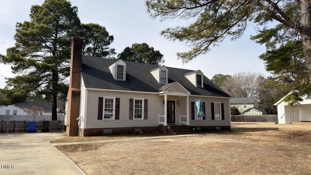 2707 Ridge Road Northwest Wilson, NC 27896 - Photo 1 of 33 a view of a white house with a large tree in front of it