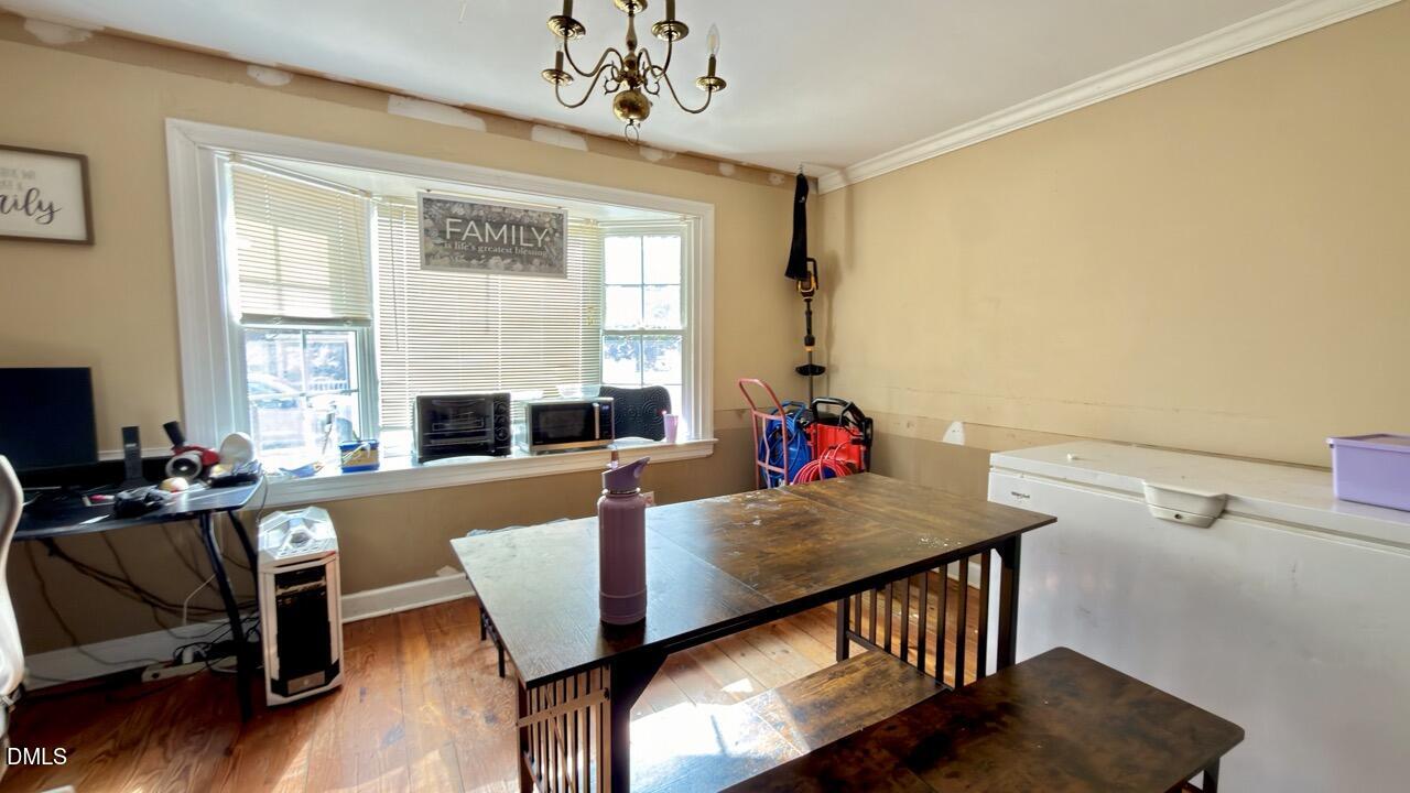 2707 Ridge Road Northwest Wilson, NC 27896 - Photo 12 of 33 a view of a dining room with furniture window and wooden floor
