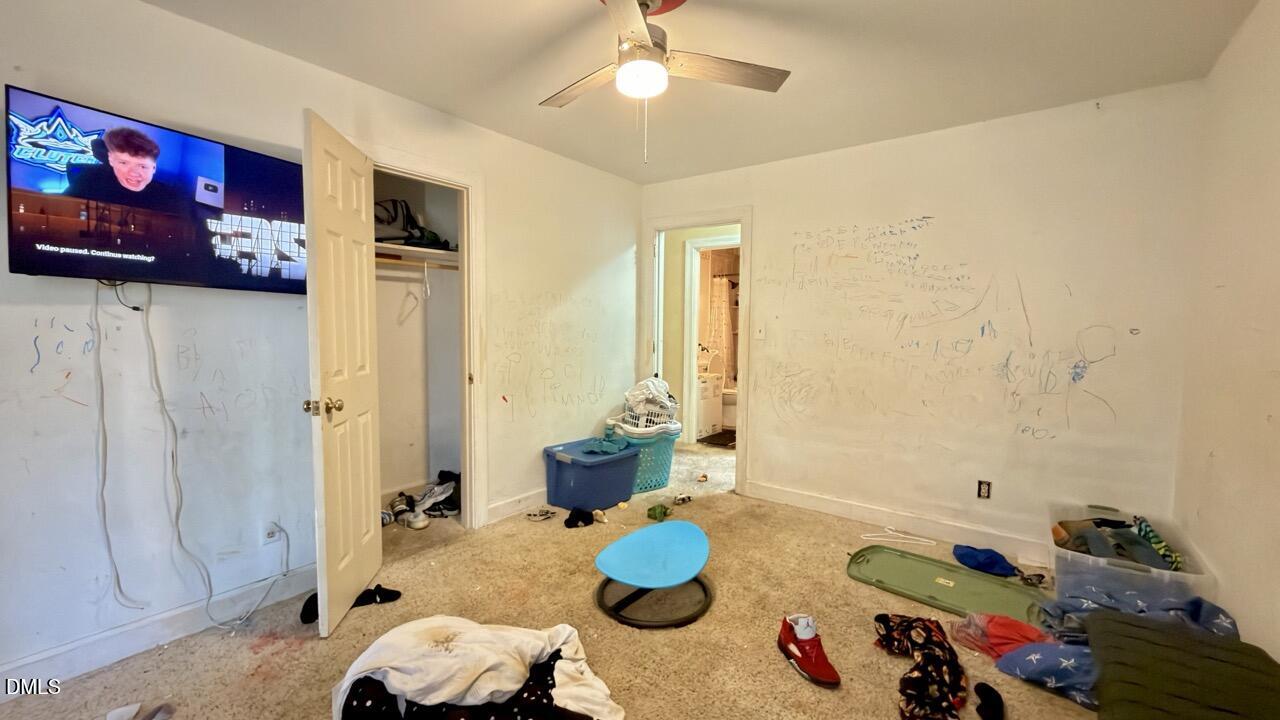 2707 Ridge Road Northwest Wilson, NC 27896 - Photo 16 of 33 a bed room with a bed and a table