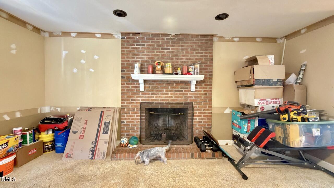 2707 Ridge Road Northwest Wilson, NC 27896 - Photo 7 of 33 a living room with furniture and a fireplace
