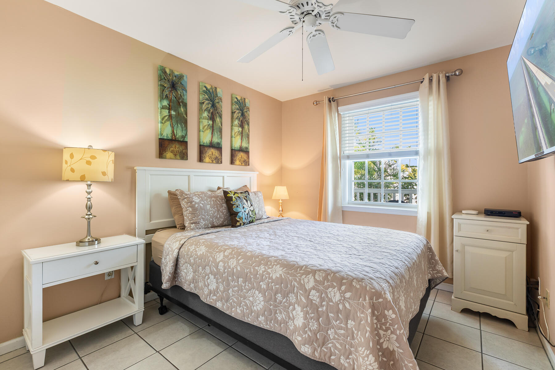 620 Thomas Street, Unit 175 Key West, FL 33040 - Photo 19 of 30 a bedroom with a bed and a window