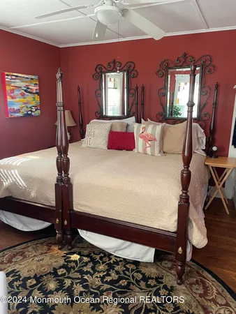 a bed room with a bed and a night stand