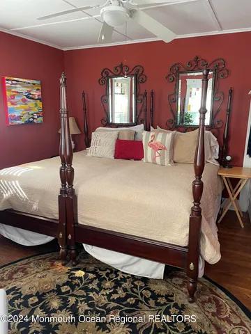 a bed room with a bed and a night stand