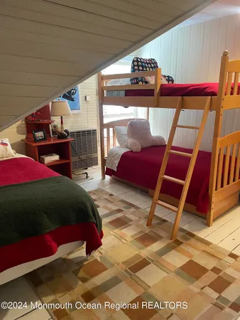 a bedroom with a bed and a table