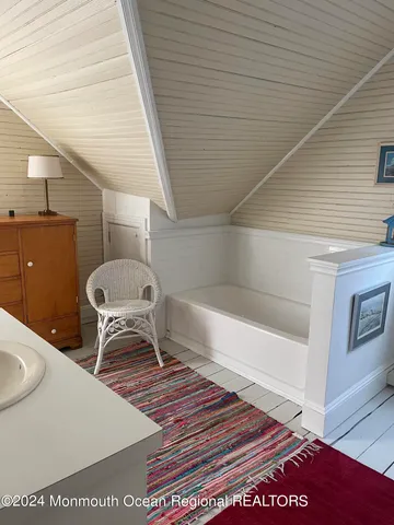 a bedroom with two beds and a window