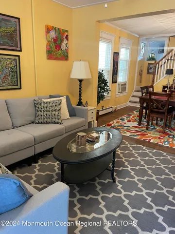 a living room with furniture and a table