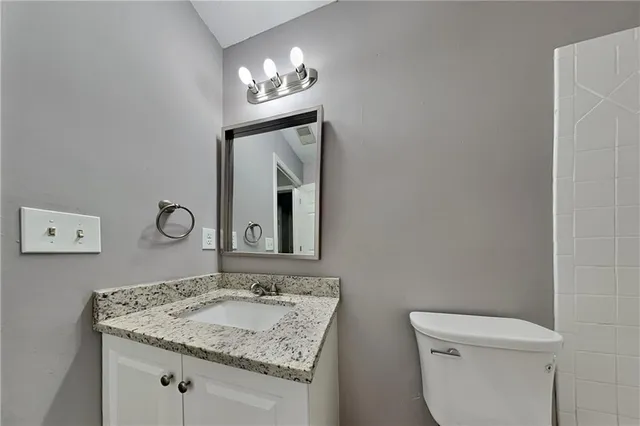 a bathroom with a bathtub and toilet