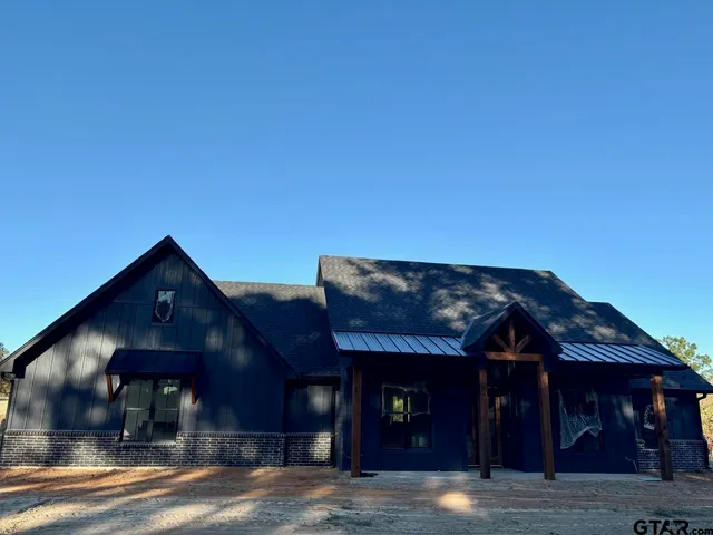 a view of a house with a street