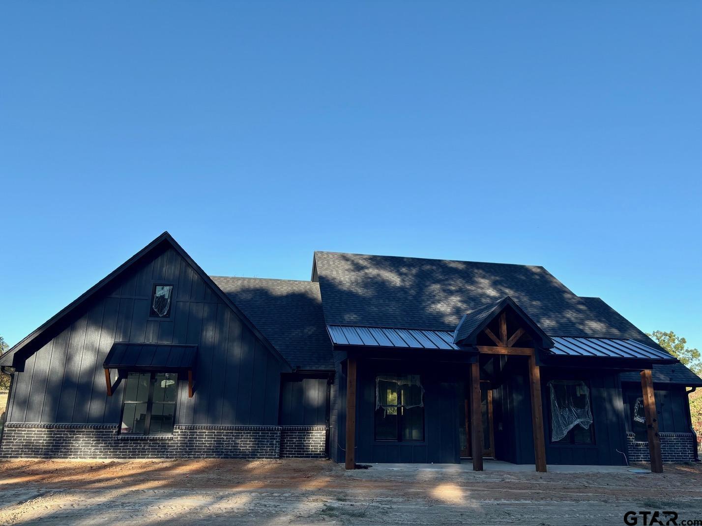 a view of a house with a street