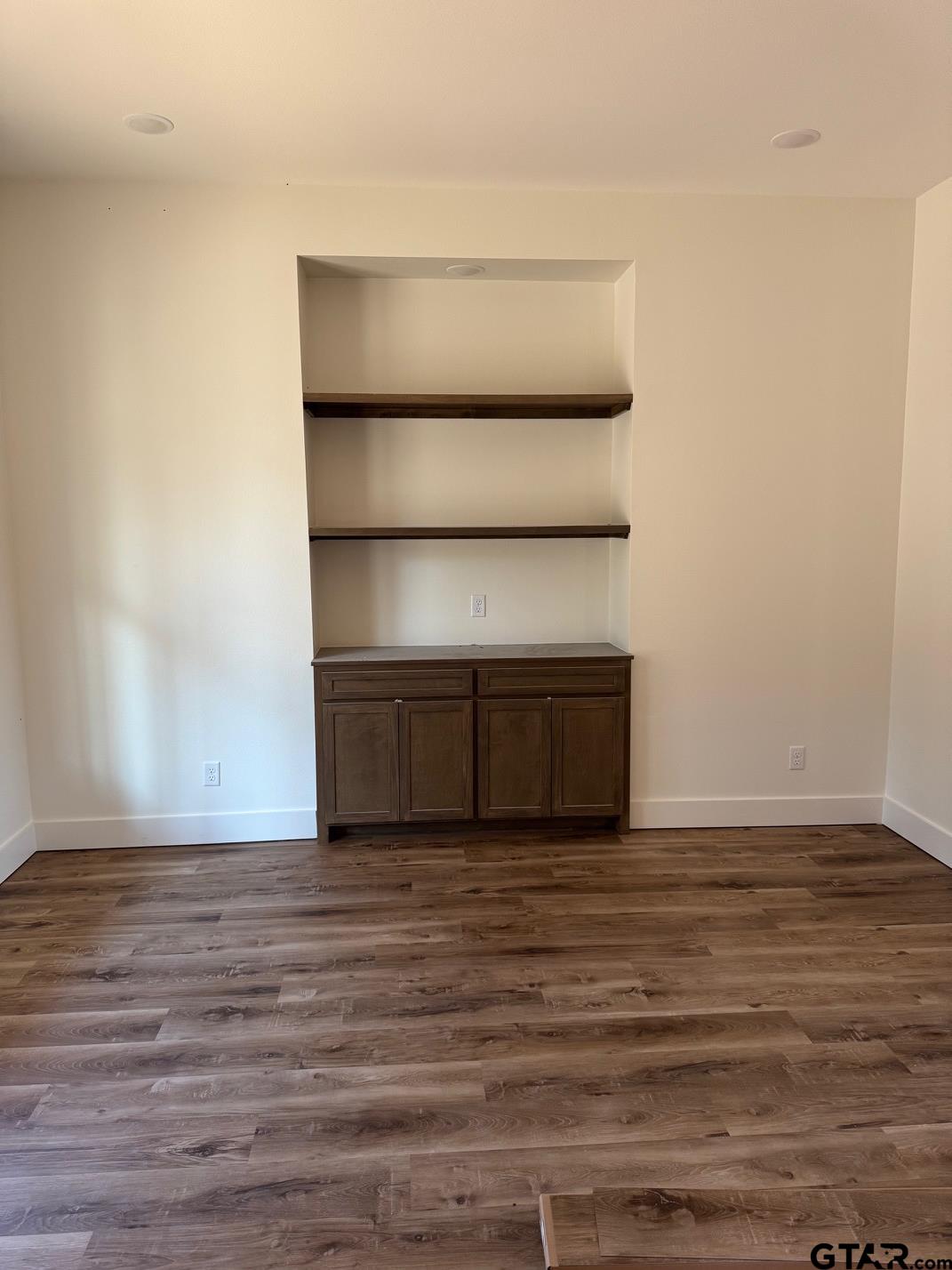 21053 County Road 26 Tyler, TX 75705 - Photo 5 of 19 a view of an empty room with wooden floor