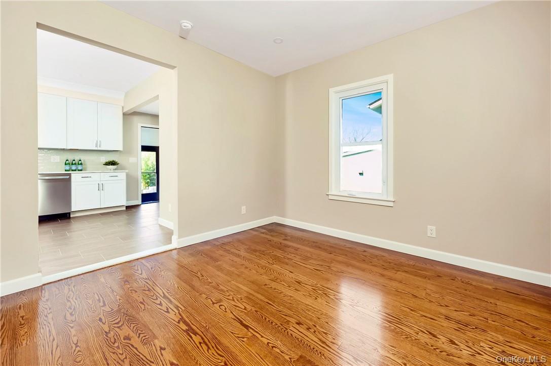 9 Todd Place, Unit 1ST FL RIGHT SIDE Ossining, NY 10562 - Photo 9 of 17 View of the Living Room without furniture. New hardwood throughout. Peek of the kitchen and separate private entrance from the back.