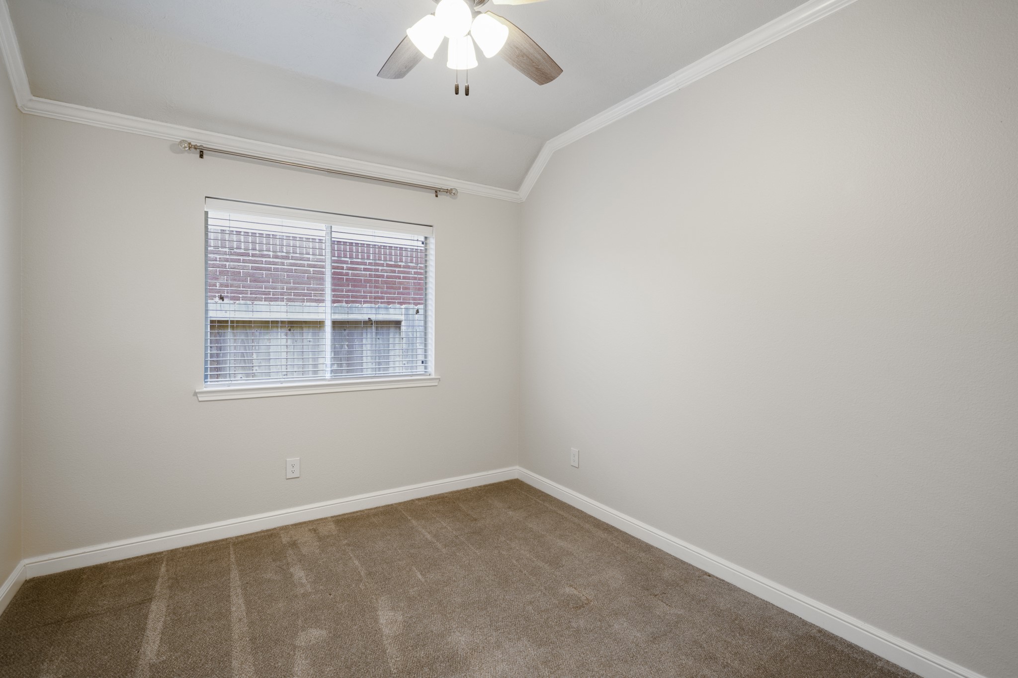 5802 Sawyer Bend Lane Spring, TX 77379 - Photo 28 of 50 an empty room with a chandelier fan