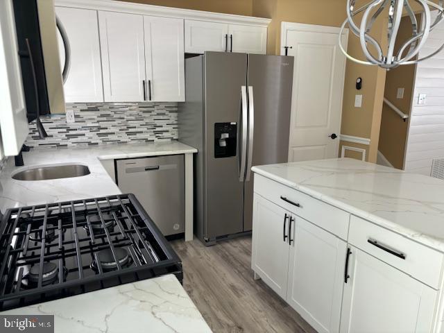 106 Bethel Road Somers Point, NJ 08244 - Photo 12 of 37 a kitchen with sink a refrigerator and a stove