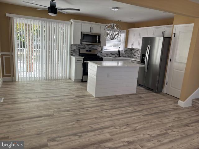 106 Bethel Road Somers Point, NJ 08244 - Photo 17 of 37 a kitchen with stainless steel appliances a refrigerator microwave and stove top oven