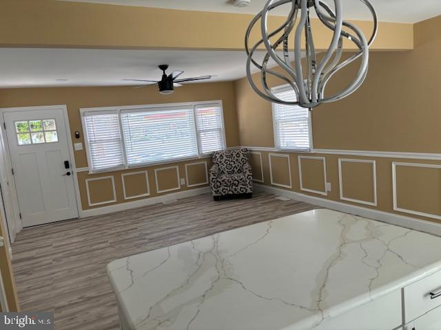 106 Bethel Road Somers Point, NJ 08244 - Photo 18 of 37 a view of a hallway with wooden floor and a chandelier