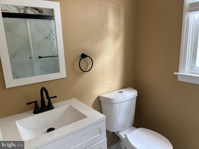 106 Bethel Road Somers Point, NJ 08244 - Photo 26 of 37 a bathroom with a sink mirror vanity and toilet