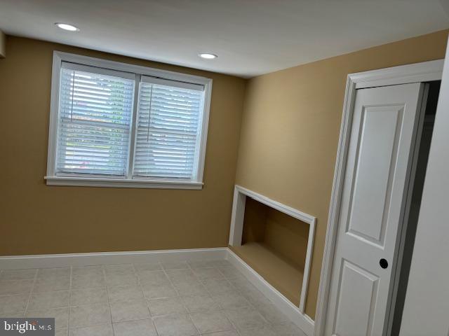 106 Bethel Road Somers Point, NJ 08244 - Photo 33 of 37 a view of an empty room with a fireplace and a window