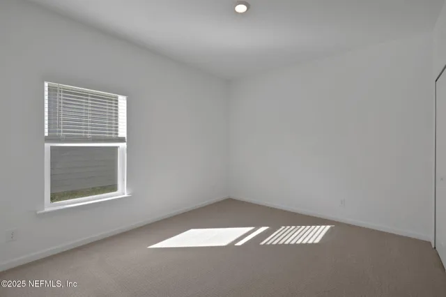 a view of a big room with wooden fence