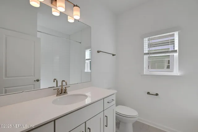 front view of a house with a garden