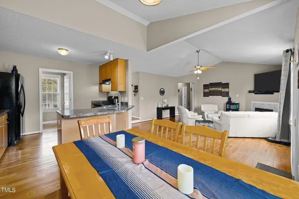 a living room with furniture fireplace and flat screen tv