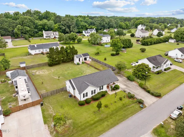 an aerial view of a house with a garden