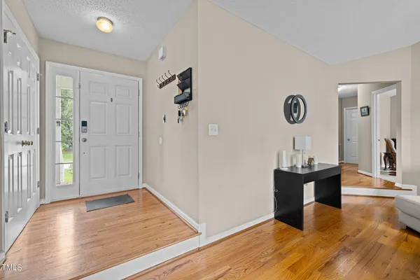 a view of a livingroom with wooden floor