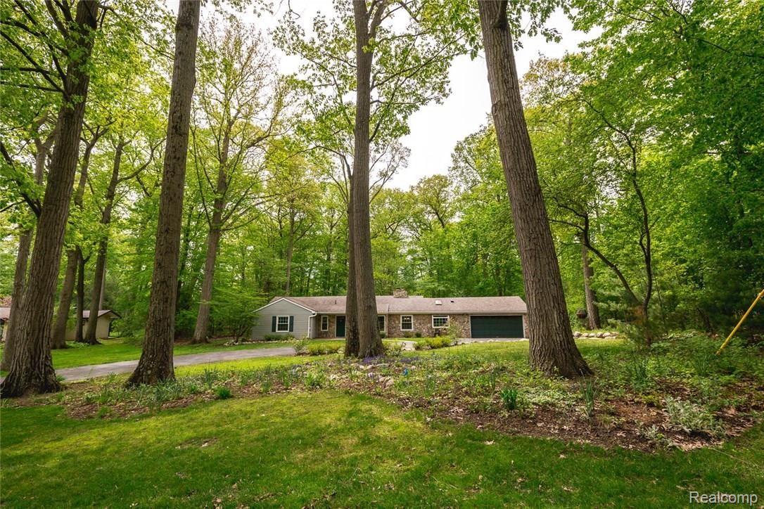 Nestled on a 1.3+ acre lot, surrounded by woods and natural beauty, yet close to shopping, highways, amenities.