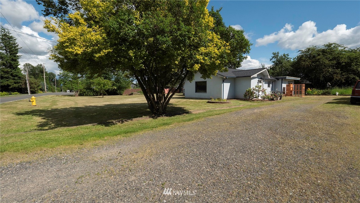 1849 Trigg Road Ferndale, WA 98248 - Photo 2 of 38 a front view of a house with a yard and garage