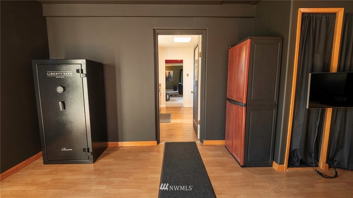 1849 Trigg Road Ferndale, WA 98248 - Photo 17 of 38 a view of a hallway with wooden floor and glass door