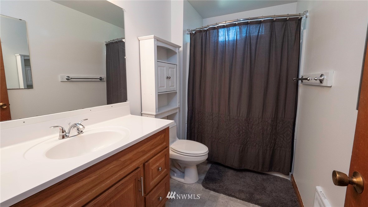1849 Trigg Road Ferndale, WA 98248 - Photo 18 of 38 a bathroom with a sink a toilet and shower