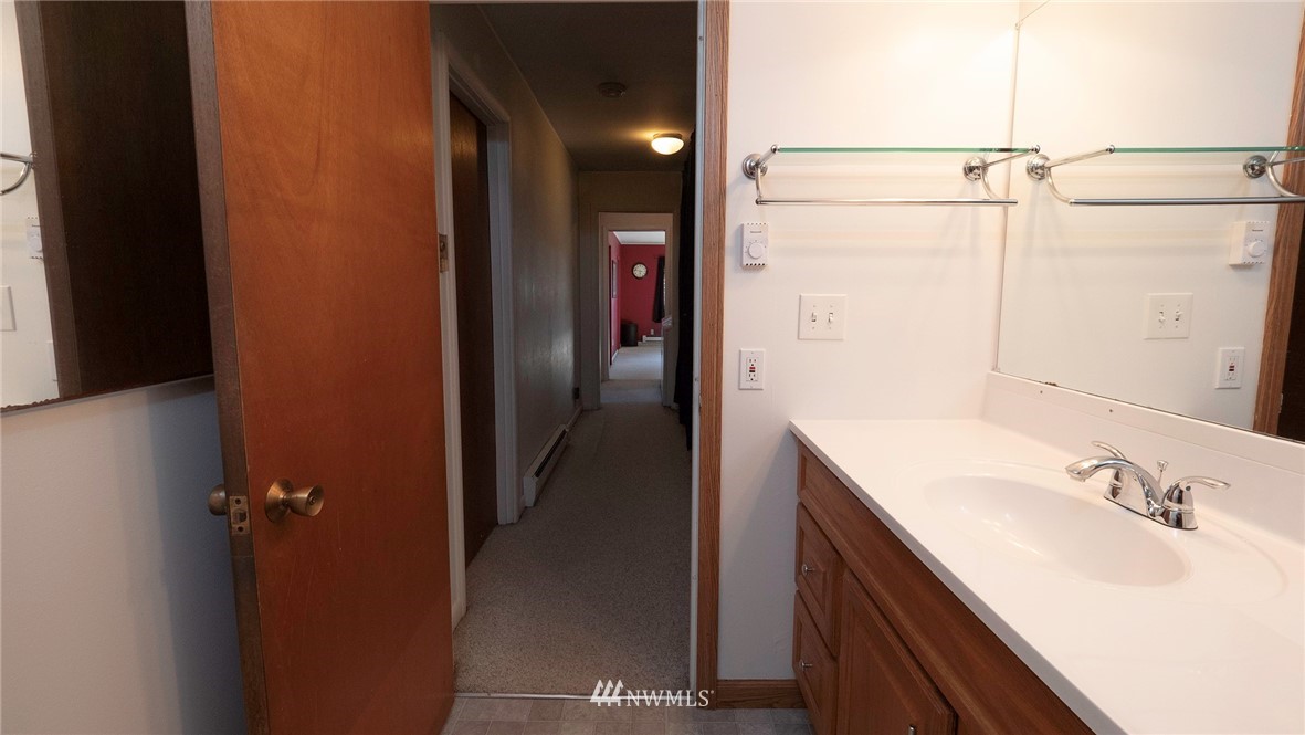 1849 Trigg Road Ferndale, WA 98248 - Photo 19 of 38 a bathroom with a double vanity sink and mirror