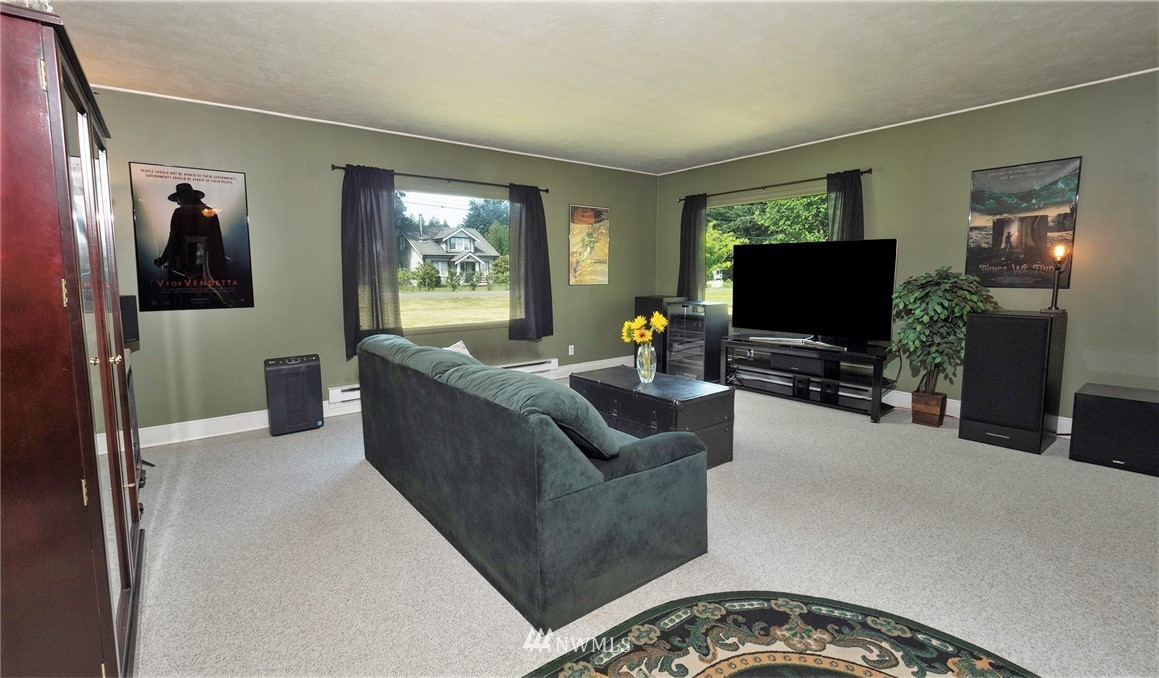 1849 Trigg Road Ferndale, WA 98248 - Photo 6 of 38 a living room with furniture and a flat screen tv