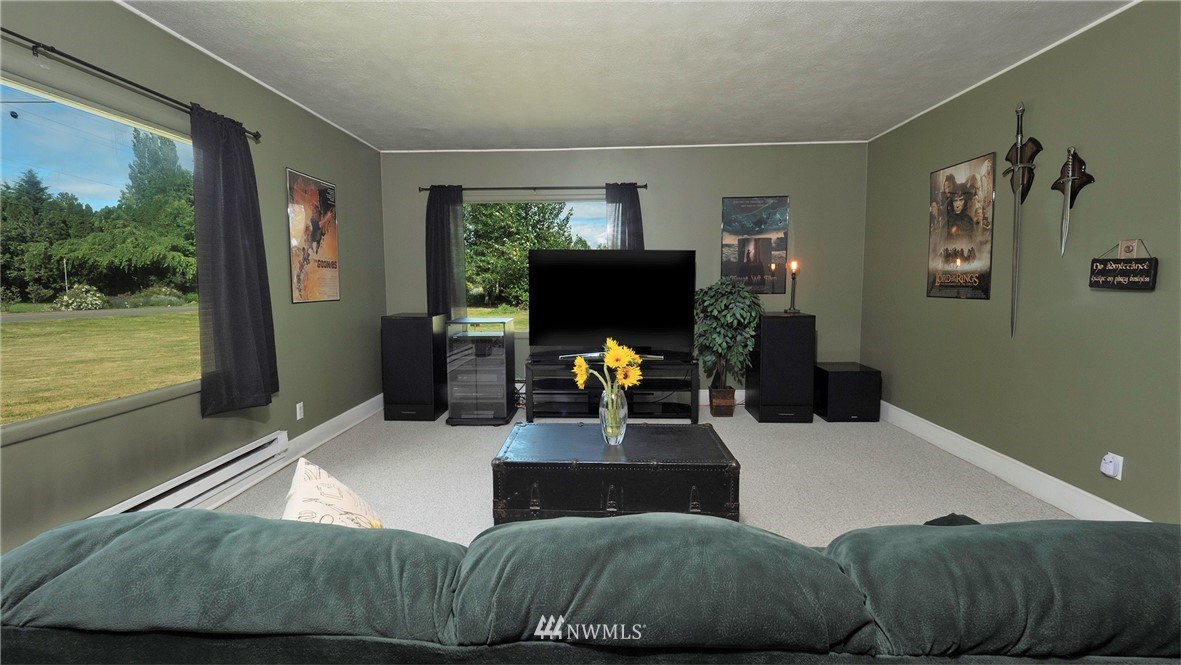 1849 Trigg Road Ferndale, WA 98248 - Photo 7 of 38 a living room with furniture and a flat screen tv