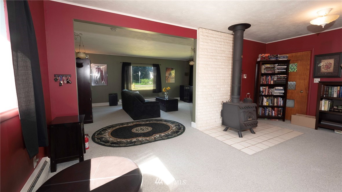 1849 Trigg Road Ferndale, WA 98248 - Photo 8 of 38 a living room with furniture and a fireplace