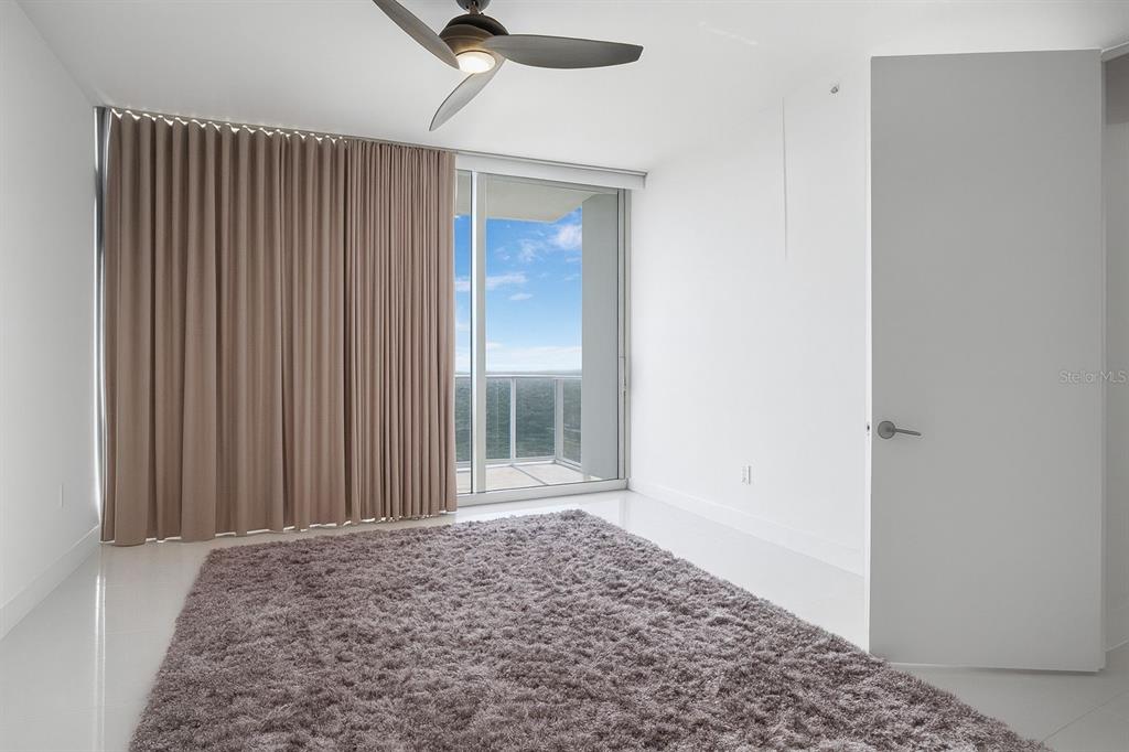 150 East Robinson Street, Unit 29B Orlando, FL 32801 - Photo 19 of 27 a view of a big room with closet and wooden floor